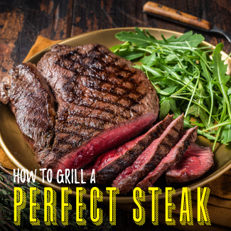 Gilled steak with slices laid out on a brown plate, sitting on a wooden table.