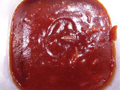 Finished sauce in a white bowl.
