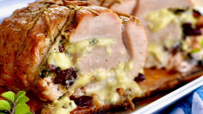 Closeup of a finished Pork Loin with Cranberry-Pistachio Chutney.