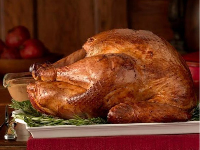 Grilled whole turkey on a what serving platter.